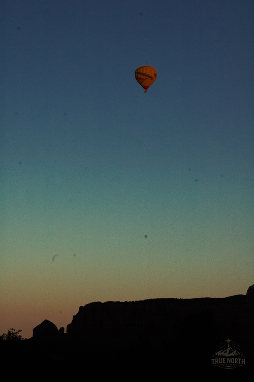 A quiet journey above the desert shadows